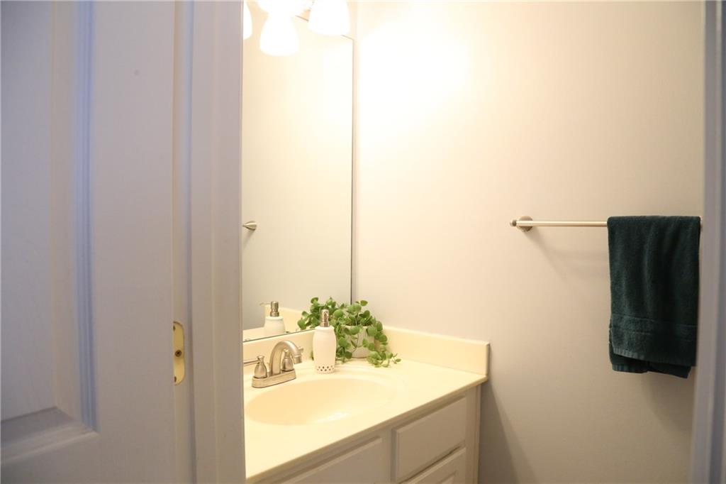 3767 Berkeley Crossing Duluth, GA 30096 - Photo 11 of 23 a bathroom with a sink and mirror