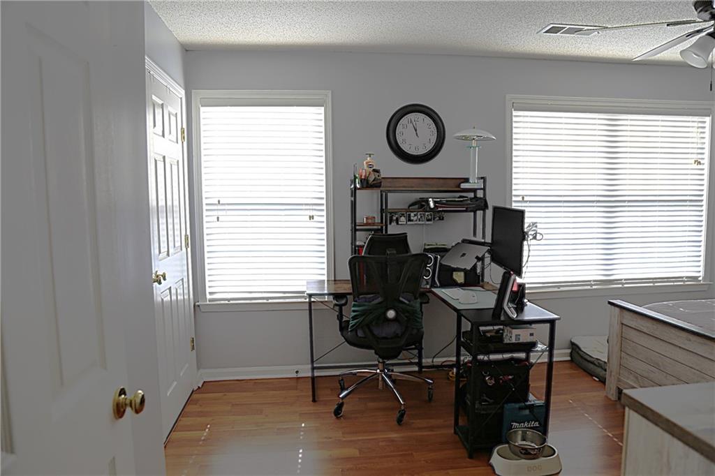 3767 Berkeley Crossing Duluth, GA 30096 - Photo 16 of 23 a view of a workspace with furniture and a window