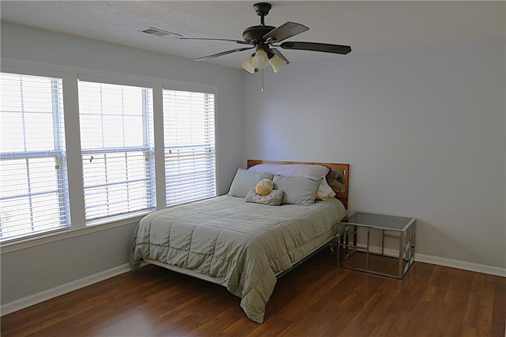 3767 Berkeley Crossing Duluth, GA 30096 - Photo 17 of 23 a bedroom with a bed and a window