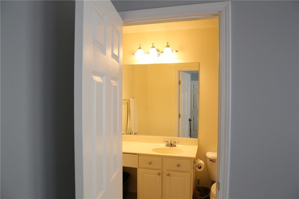 3767 Berkeley Crossing Duluth, GA 30096 - Photo 18 of 23 a bathroom with a sink mirror and a vanity