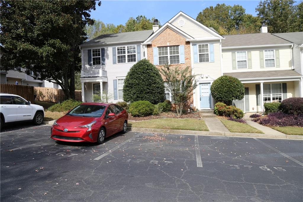 3767 Berkeley Crossing Duluth, GA 30096 - Photo 2 of 23 a front view of a house with a yard