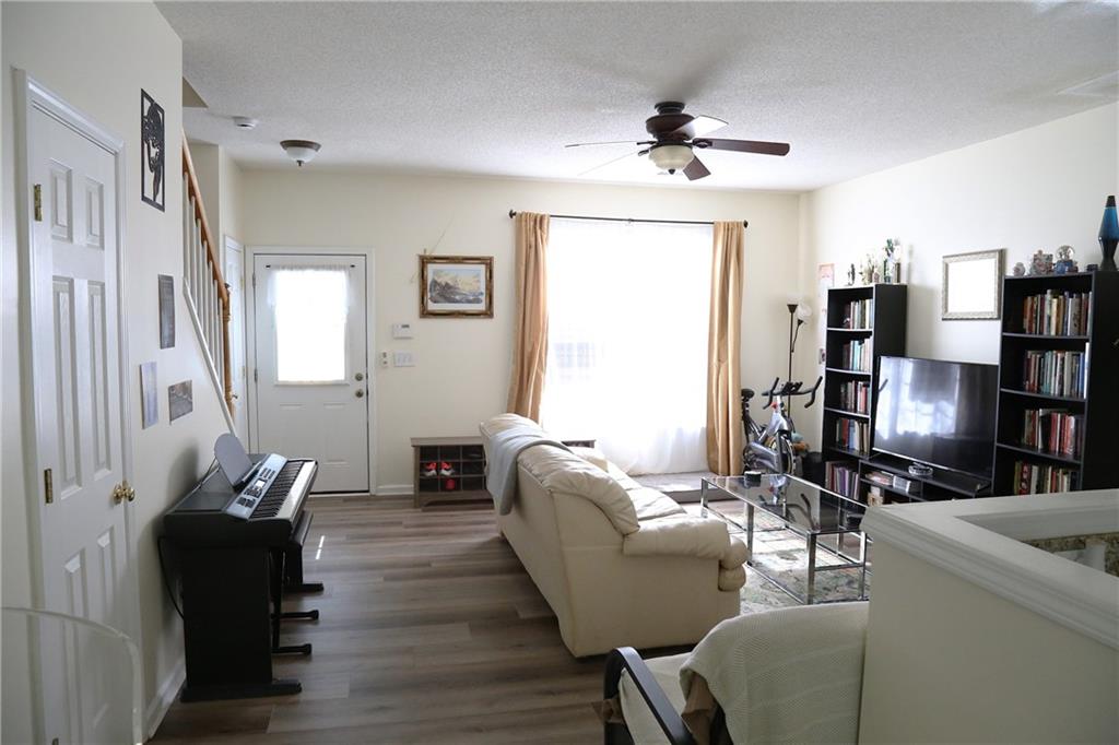 3767 Berkeley Crossing Duluth, GA 30096 - Photo 3 of 23 a living room with furniture and a flat screen tv