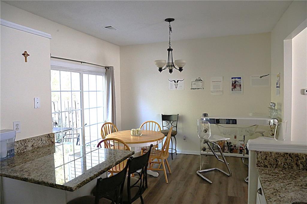 3767 Berkeley Crossing Duluth, GA 30096 - Photo 10 of 23 a view of a dining room with furniture window and outside view
