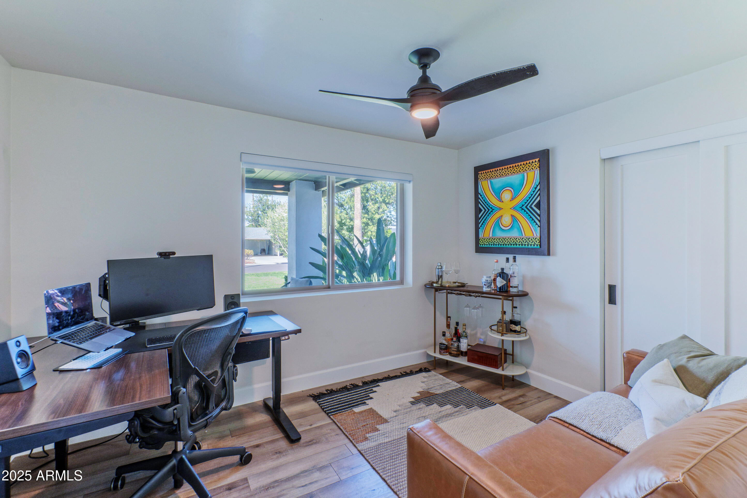 4229 North 34th Street Phoenix, AZ 85018 - Photo 12 of 20 a workspace with furniture and ceiling fan
