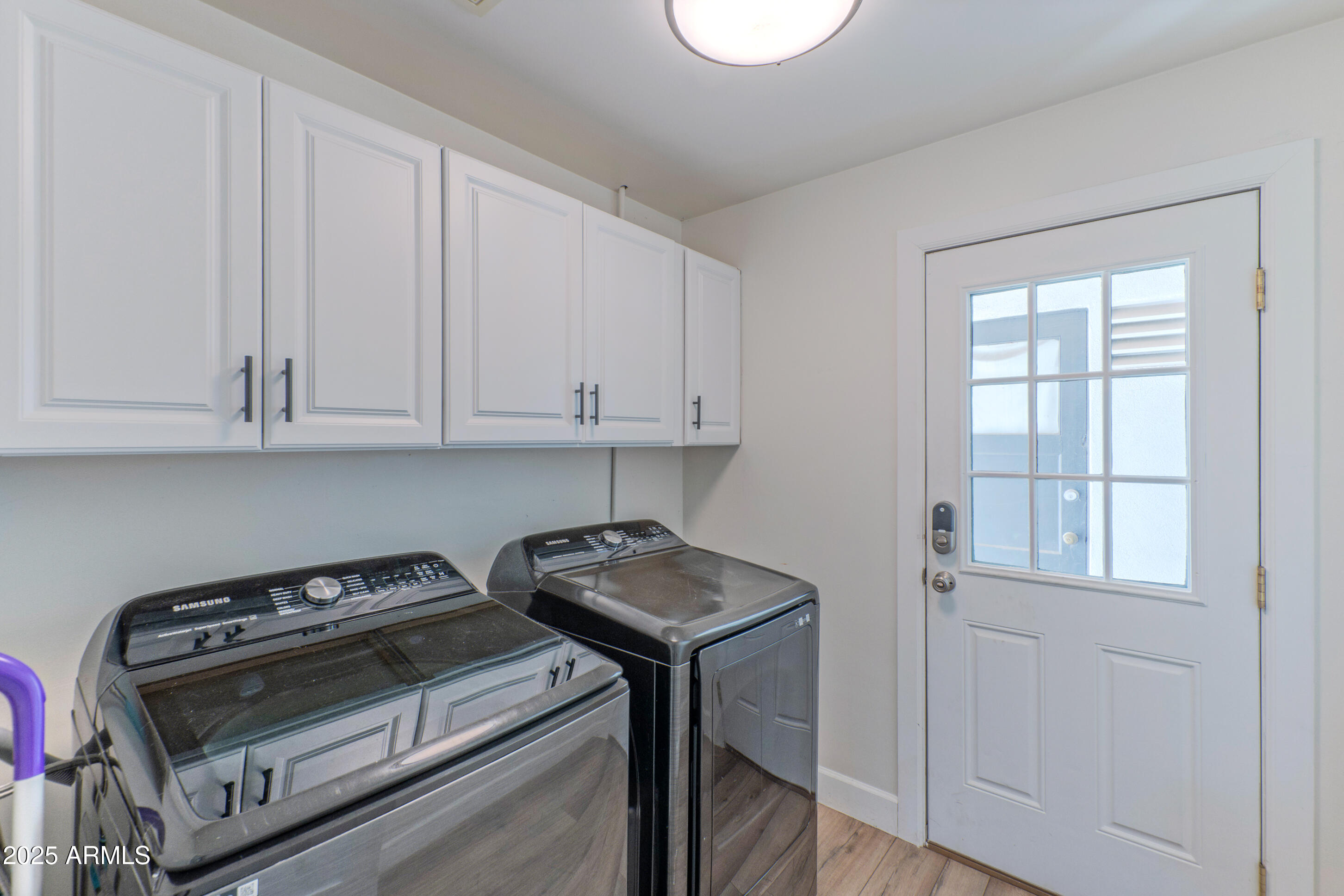 4229 North 34th Street Phoenix, AZ 85018 - Photo 14 of 20 a view of a kitchen with appliances and cabinets