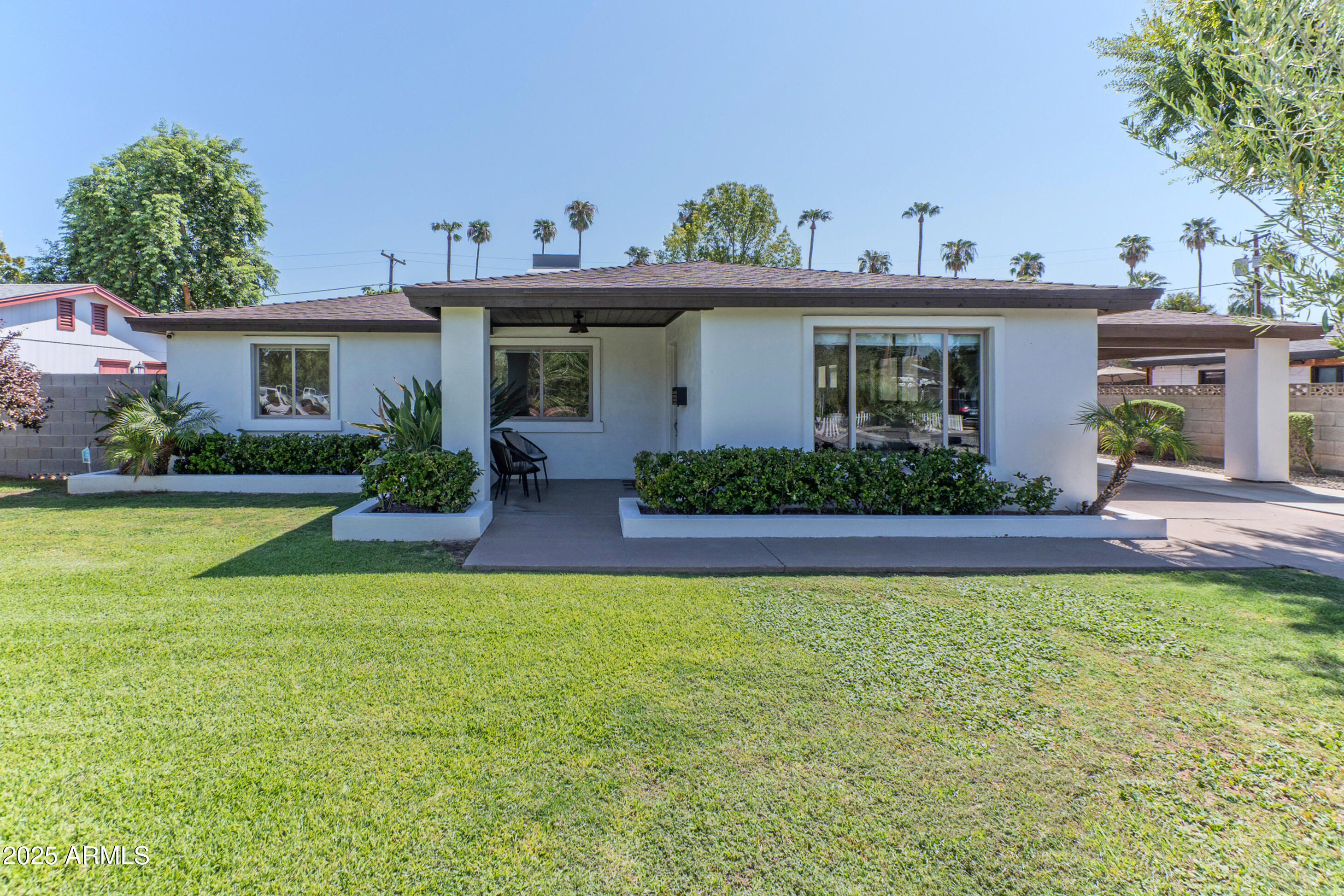 4229 North 34th Street Phoenix, AZ 85018 - Photo 15 of 20 a view of a house with swimming pool yard and potted plants