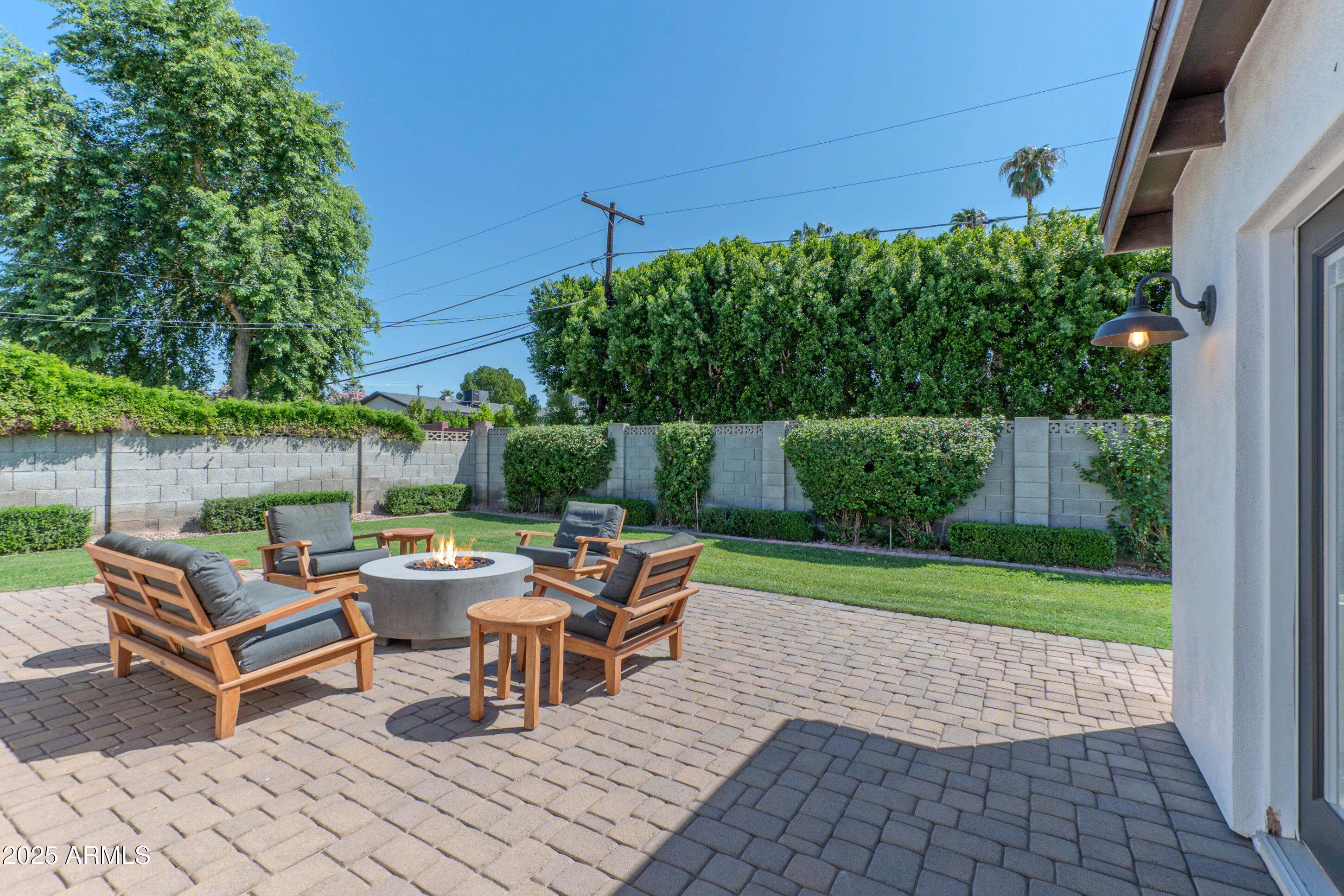 4229 North 34th Street Phoenix, AZ 85018 - Photo 16 of 20 a backyard of a house with outdoor seating
