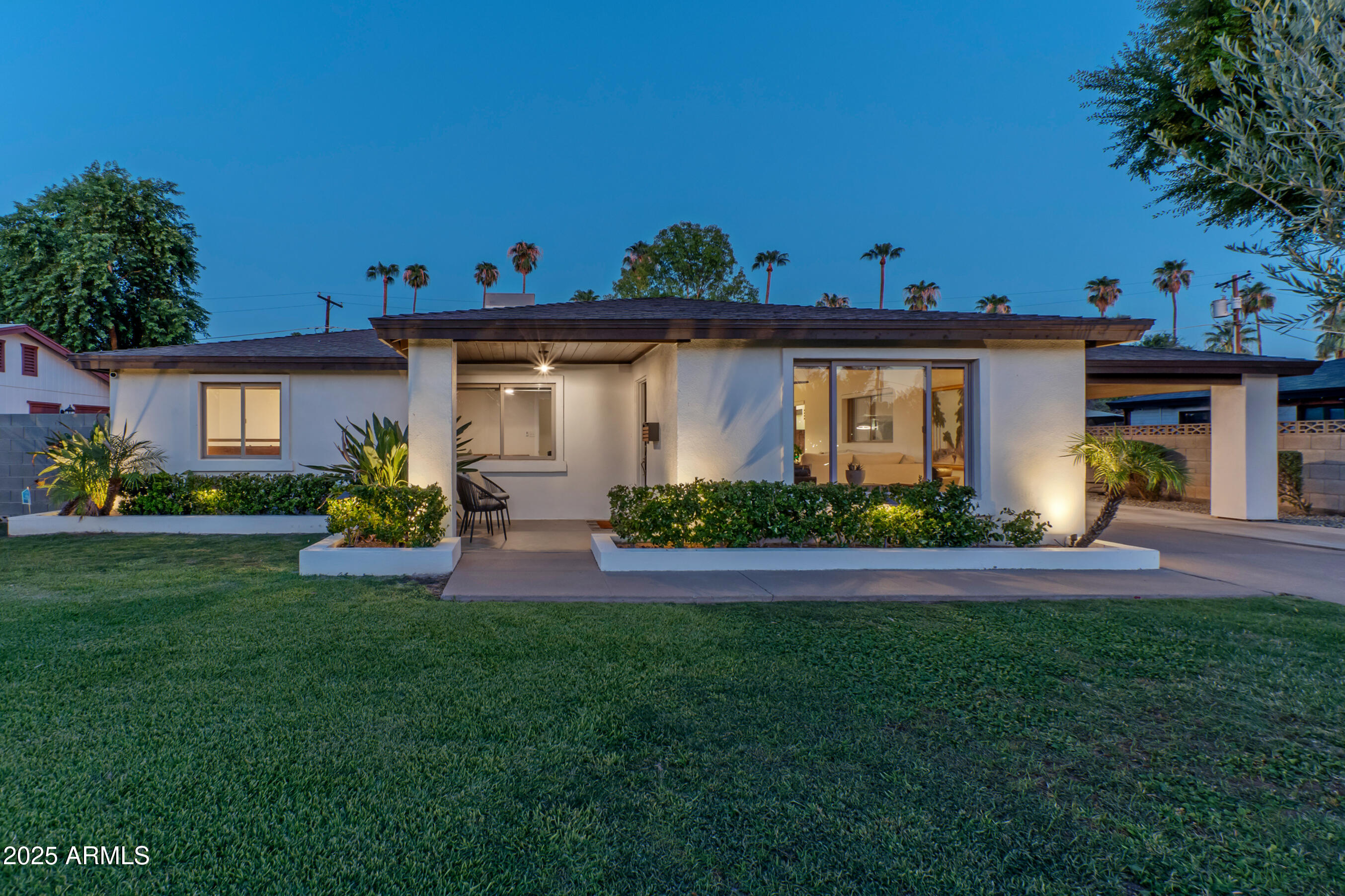 4229 North 34th Street Phoenix, AZ 85018 - Photo 19 of 20 a front view of a house with garden and porch