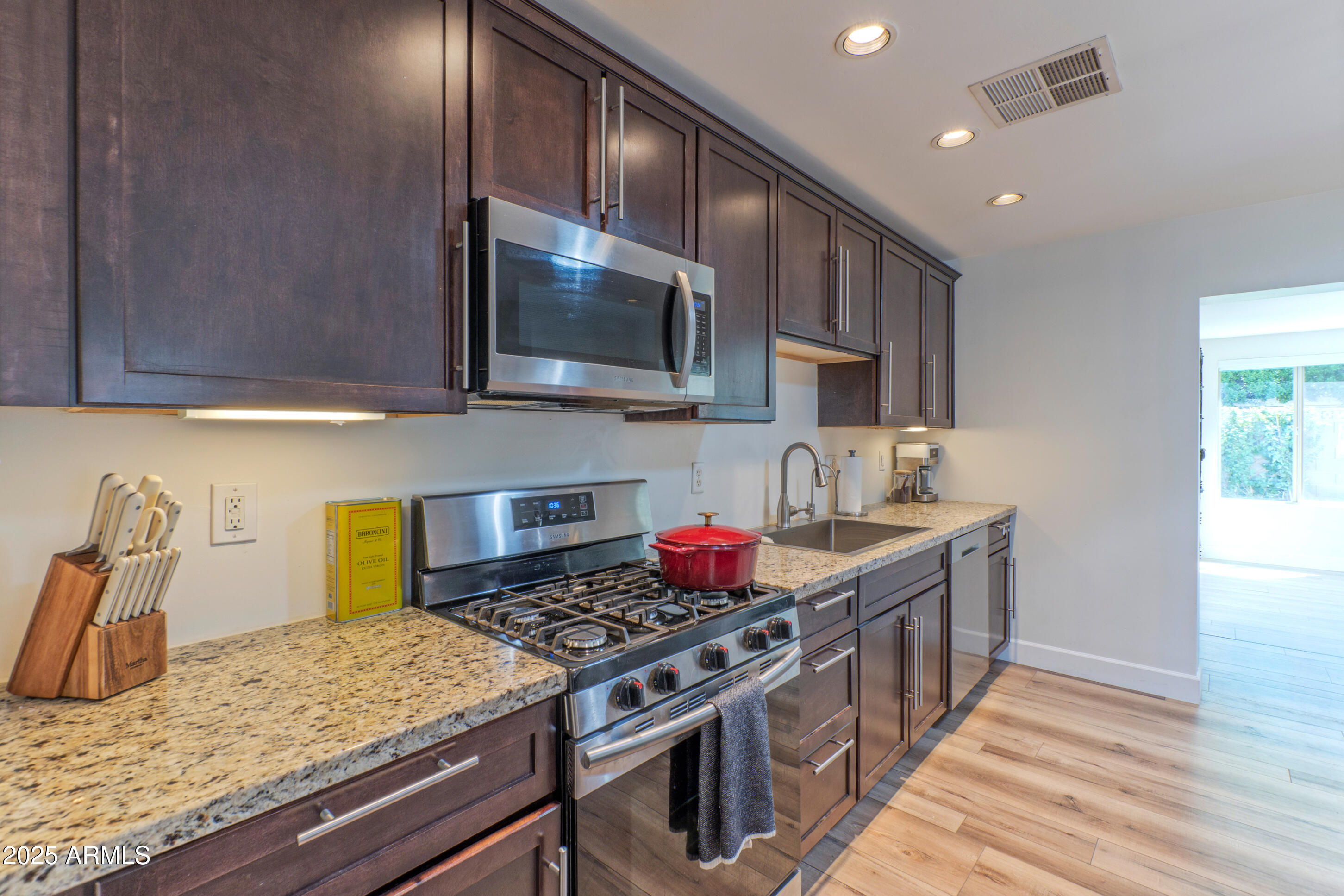 4229 North 34th Street Phoenix, AZ 85018 - Photo 6 of 20 a kitchen with a stove and a sink
