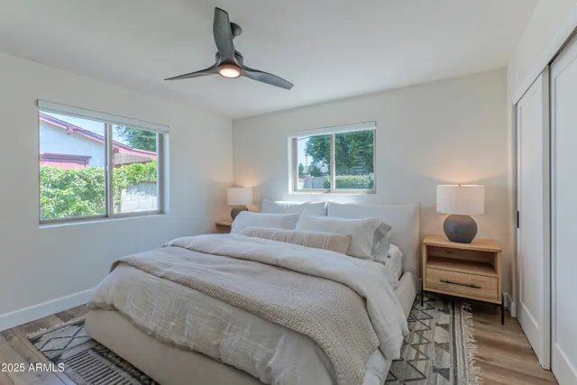 a bedroom with a bed and a window