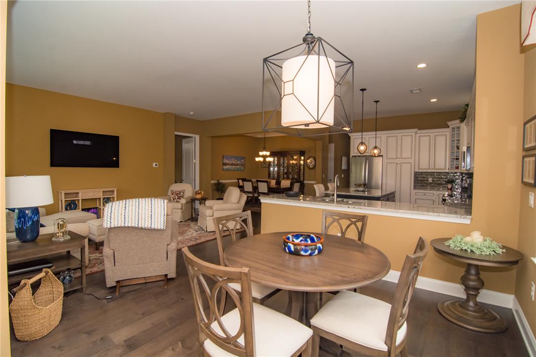 4097 Rutz Lane Allentown, PA 18104 - Photo 56 of 59 An open floorplan seamlessly connects the casual dining area, kitchen, and living space.
