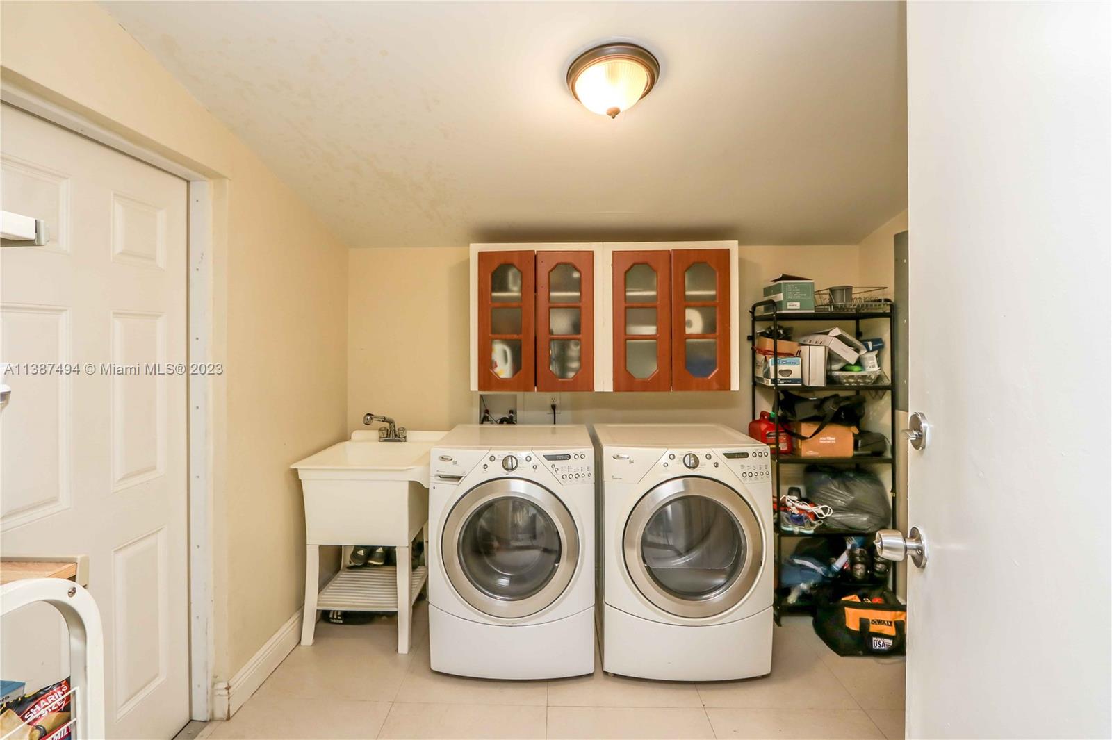 9275 Southwest 45th Street Miami, FL 33165 - Photo 11 of 23 a utility room with dryer and washer