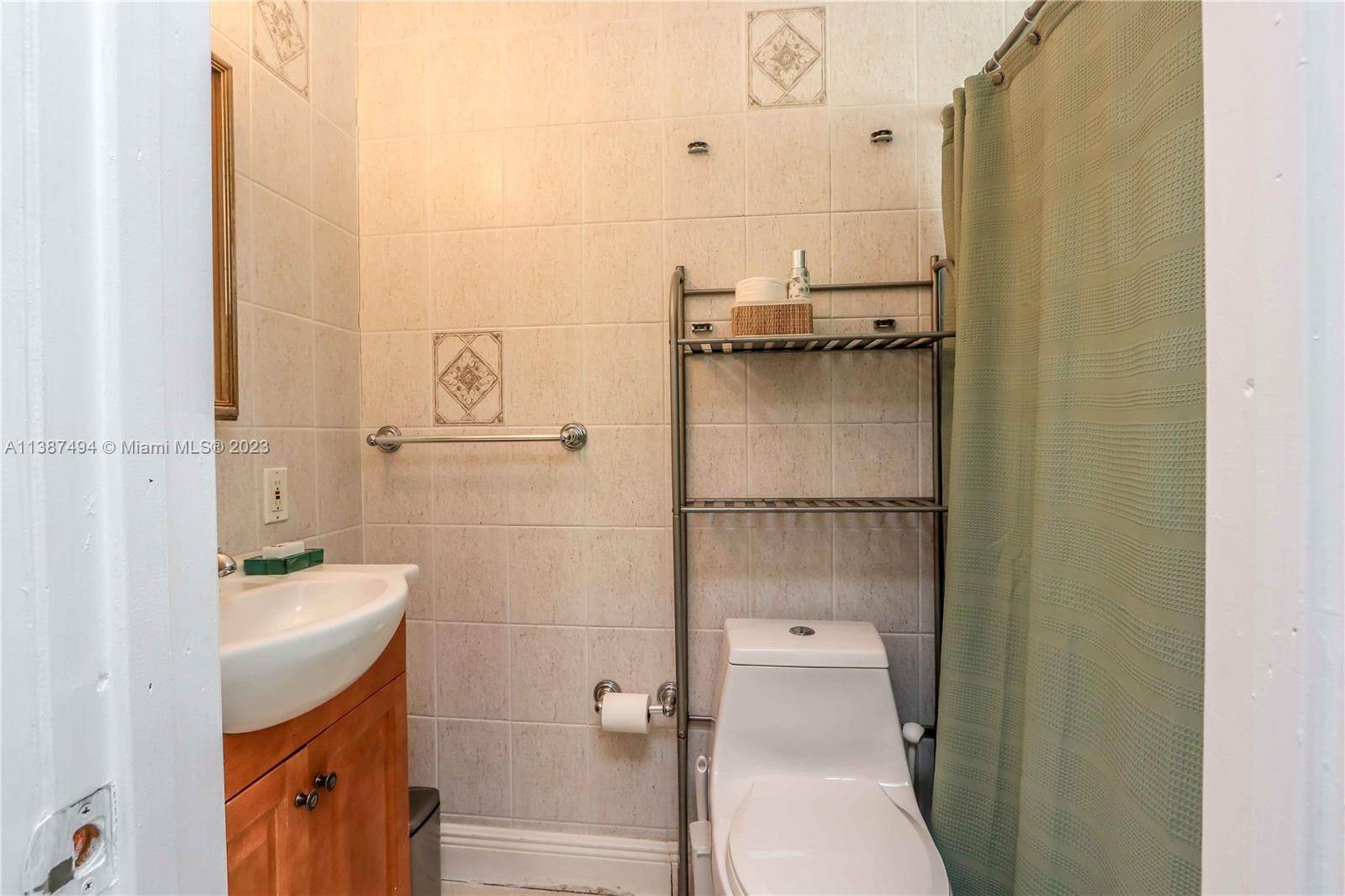 9275 Southwest 45th Street Miami, FL 33165 - Photo 14 of 23 a bathroom with a sink a toilet and shower