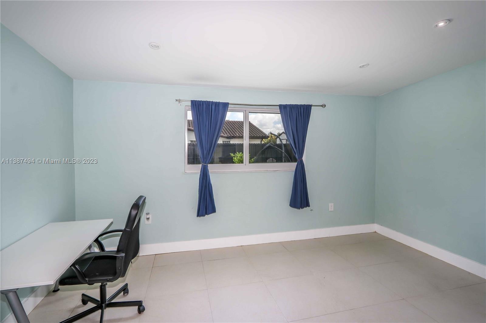 9275 Southwest 45th Street Miami, FL 33165 - Photo 18 of 23 a room with a chair and a window