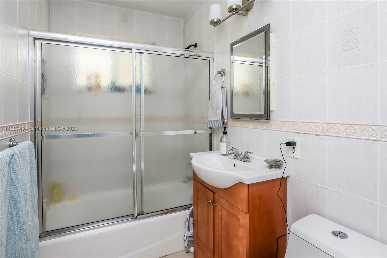 9275 Southwest 45th Street Miami, FL 33165 - Photo 20 of 23 a bathroom with a sink toilet and shower