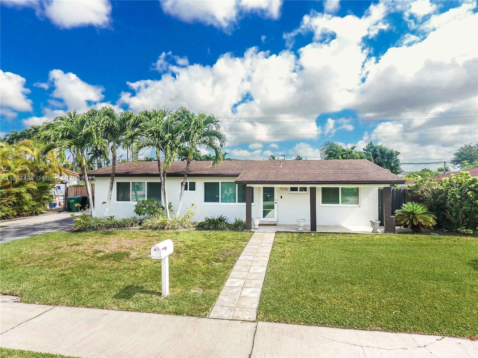 9275 Southwest 45th Street Miami, FL 33165 - Photo 21 of 23 front view of a house with a yard