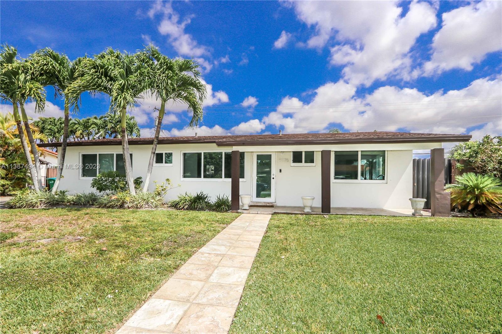 9275 Southwest 45th Street Miami, FL 33165 - Photo 22 of 23 front view of a house with a yard