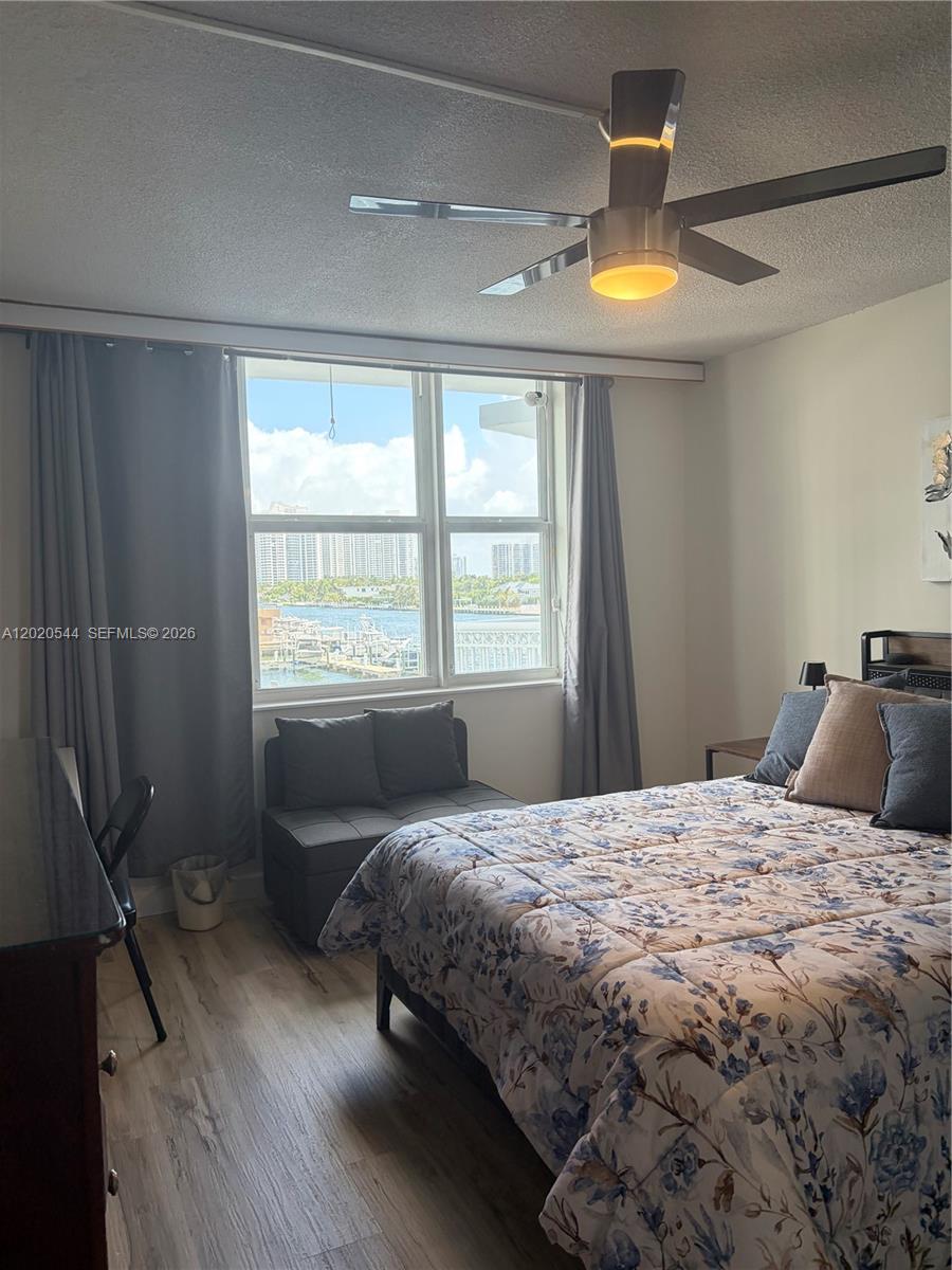 1913 South Ocean Drive, Unit 427 Hallandale Beach, FL 33009 - Photo 15 of 16 a bedroom with a bed and wooden floor