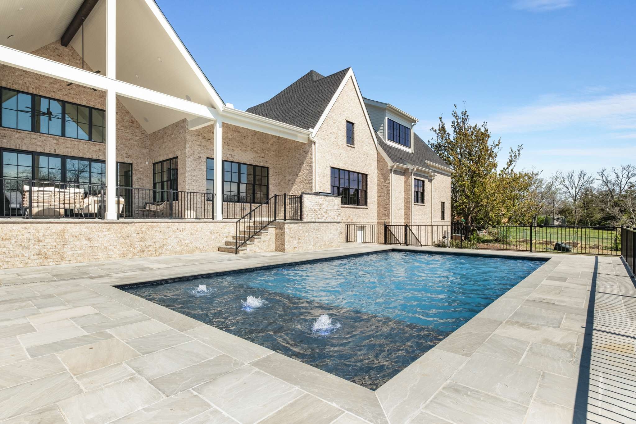 a view of a house with swimming pool
