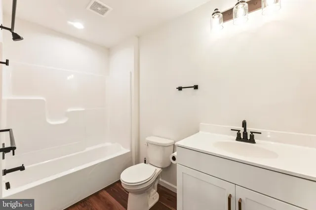 a bathroom with a sink a toilet and a bathtub