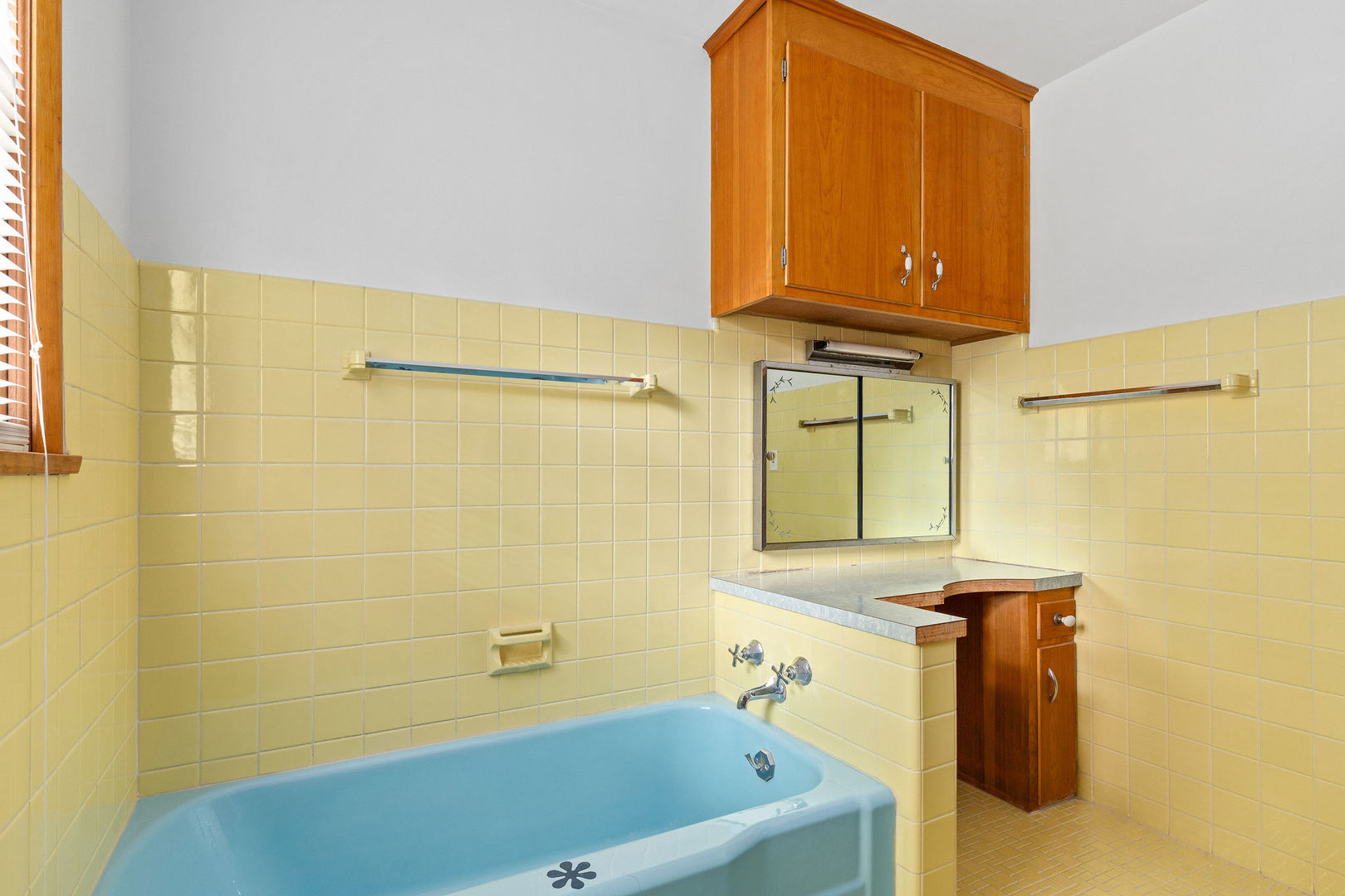202 Sears Street Plano, IL 60545 - Photo 12 of 32 a bathroom with a sink and a tub
