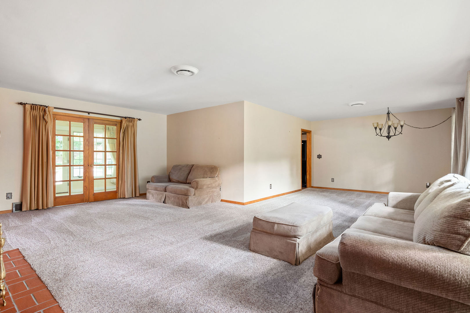 202 Sears Street Plano, IL 60545 - Photo 15 of 32 a bedroom with furniture and a large window