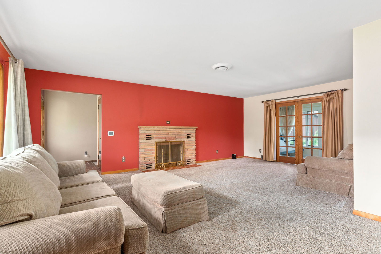 202 Sears Street Plano, IL 60545 - Photo 19 of 32 a living room with furniture a flat screen tv and a large window