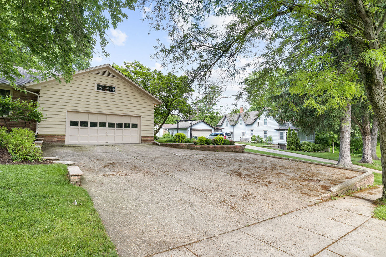 202 Sears Street Plano, IL 60545 - Photo 2 of 32 a sign board with tree in front of it