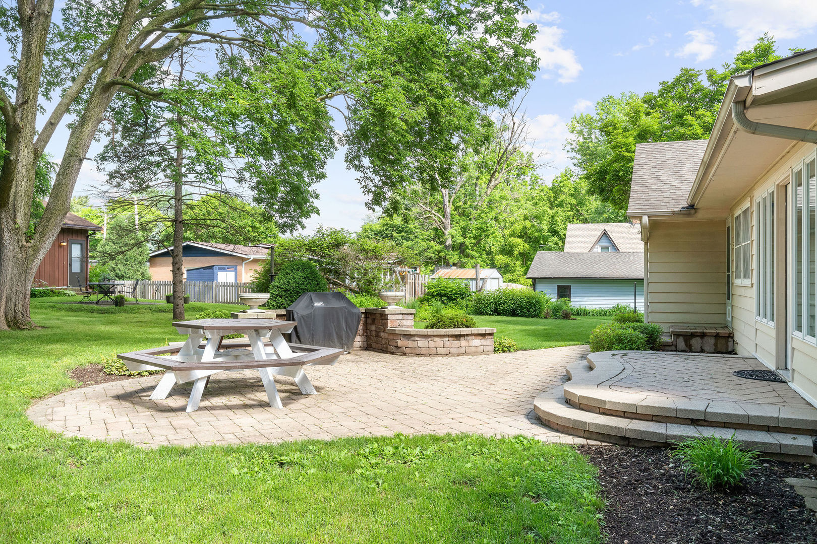 202 Sears Street Plano, IL 60545 - Photo 26 of 32 a view of a chair and table in backyard of the house