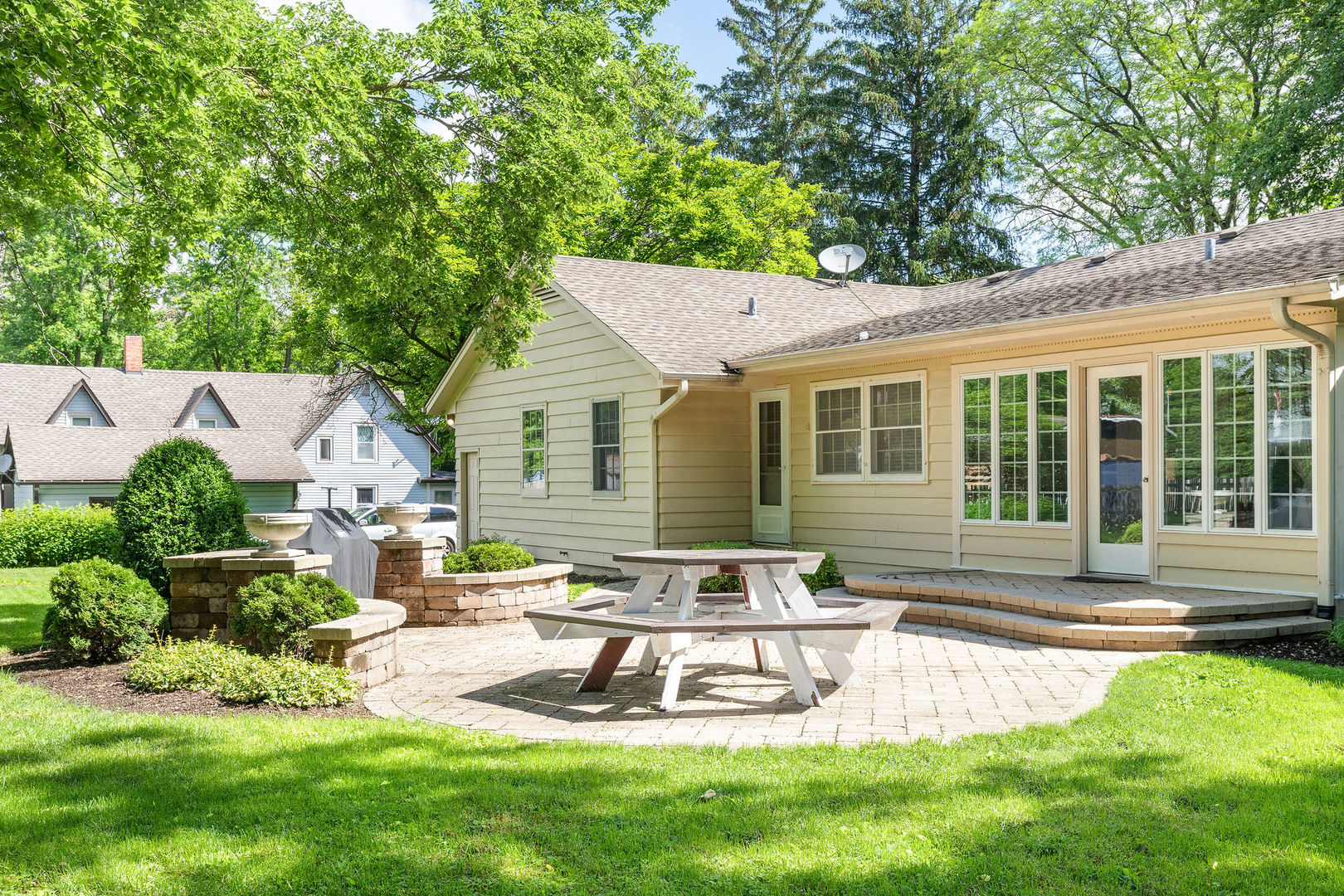 202 Sears Street Plano, IL 60545 - Photo 27 of 32 a front view of a house with a yard table and chairs