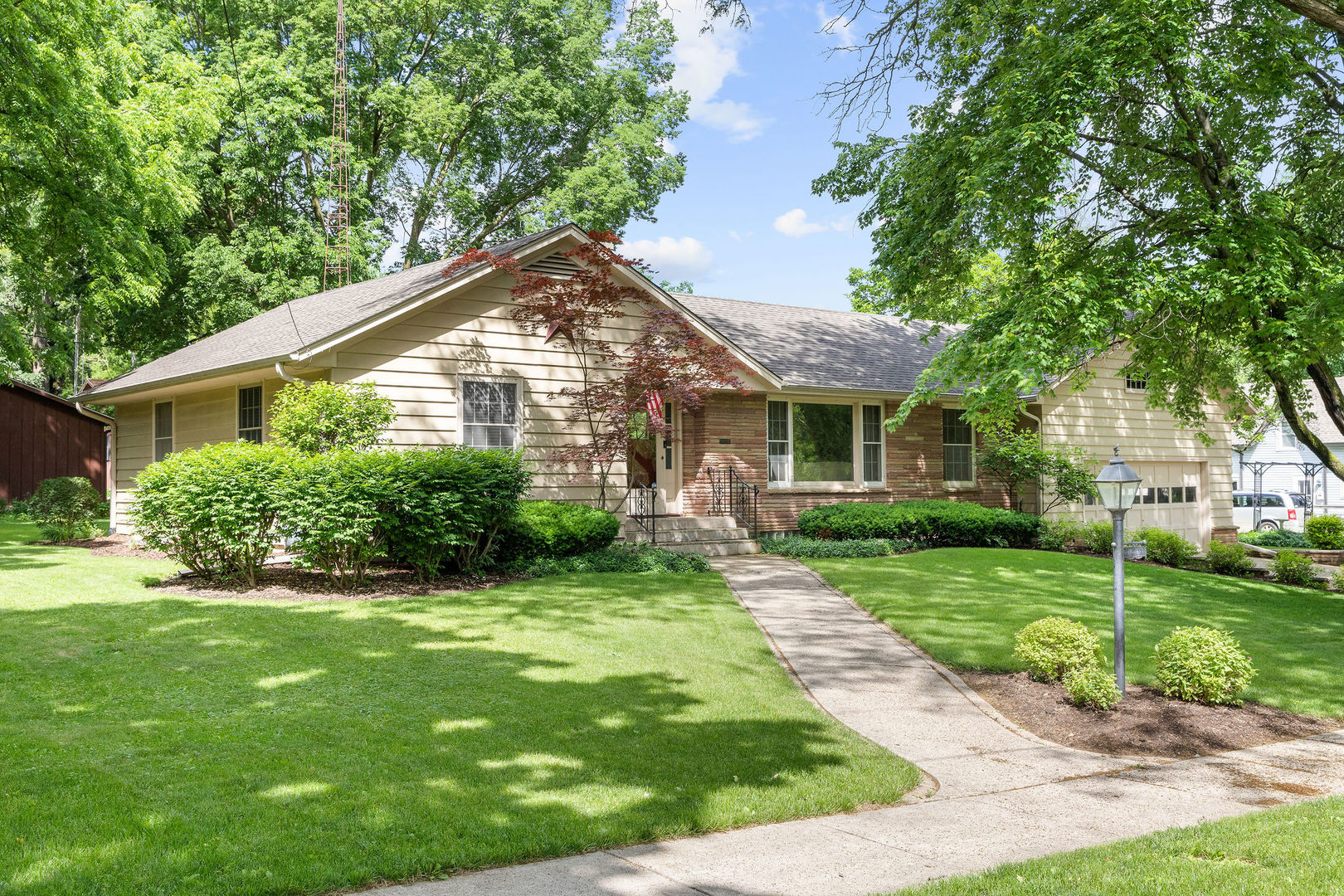 202 Sears Street Plano, IL 60545 - Photo 3 of 32 a front view of a house with a yard