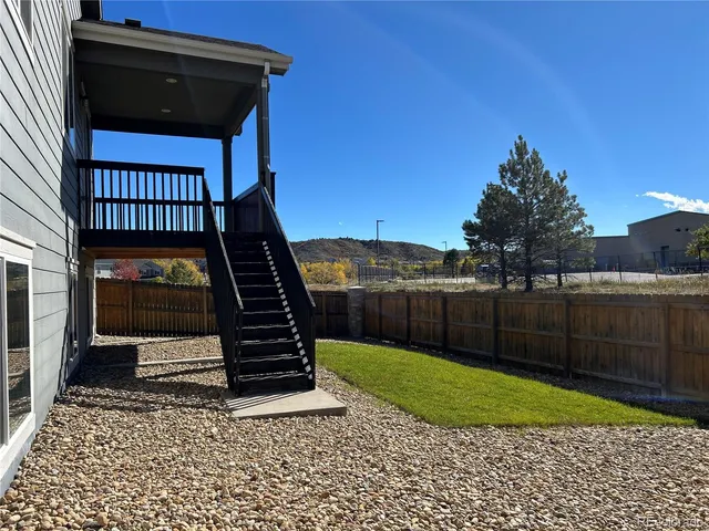 a view of a deck with a floor and fence