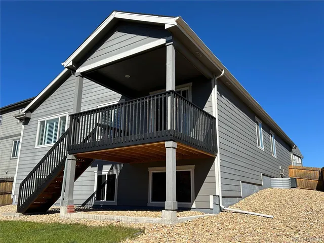 a view of a house with wooden stairs