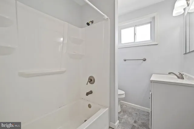 a bathroom with a bathtub and shower