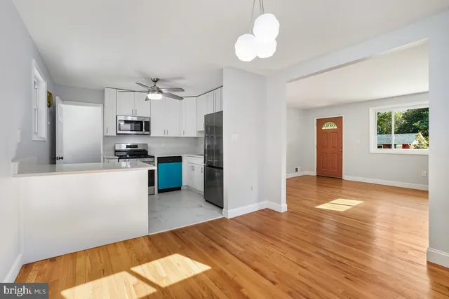 a kitchen with a refrigerator stove and microwave