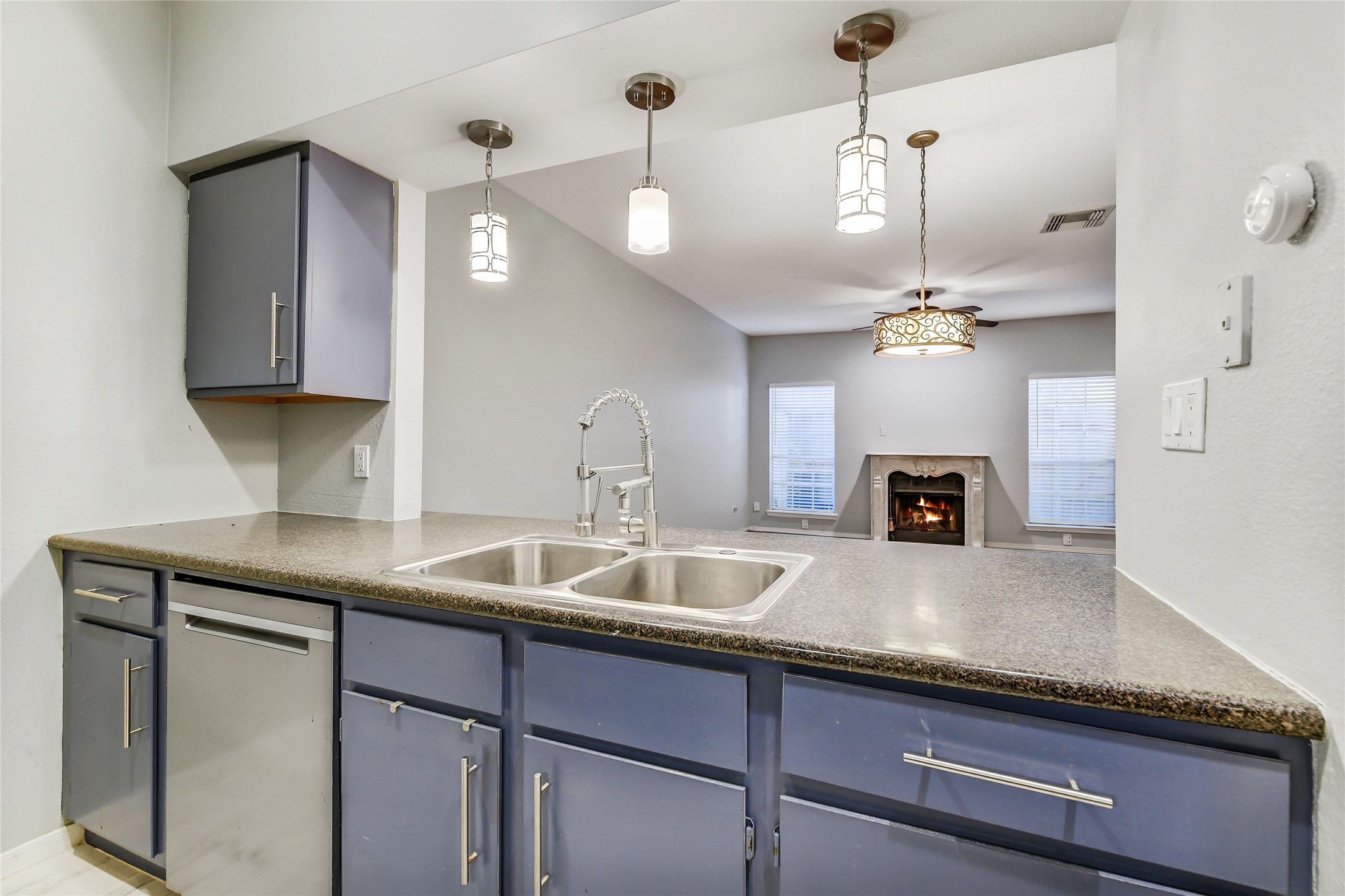 4001 Tanglewilde Street, Unit 1402 Houston, TX 77063 - Photo 11 of 23 This kitchen seamlessly opens to the dining area, featuring stylish pendant lighting and updated stainless steel fixtures and hardware, creating an inviting space perfect for entertaining or casual buffet service.