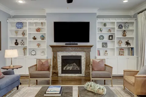 a view of a livingroom with furniture window and wooden floor