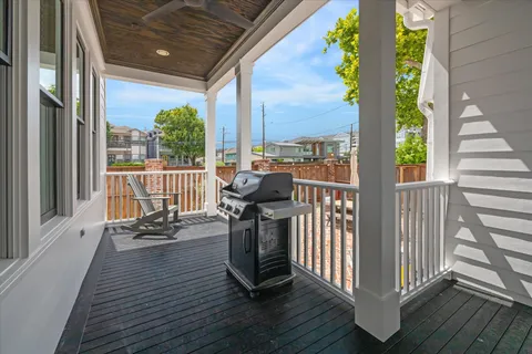 a bathroom with a granite countertop sink toilet a large mirror a bathtub and shower
