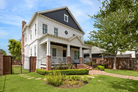 a utility room with granite countertop cabinets and washer
