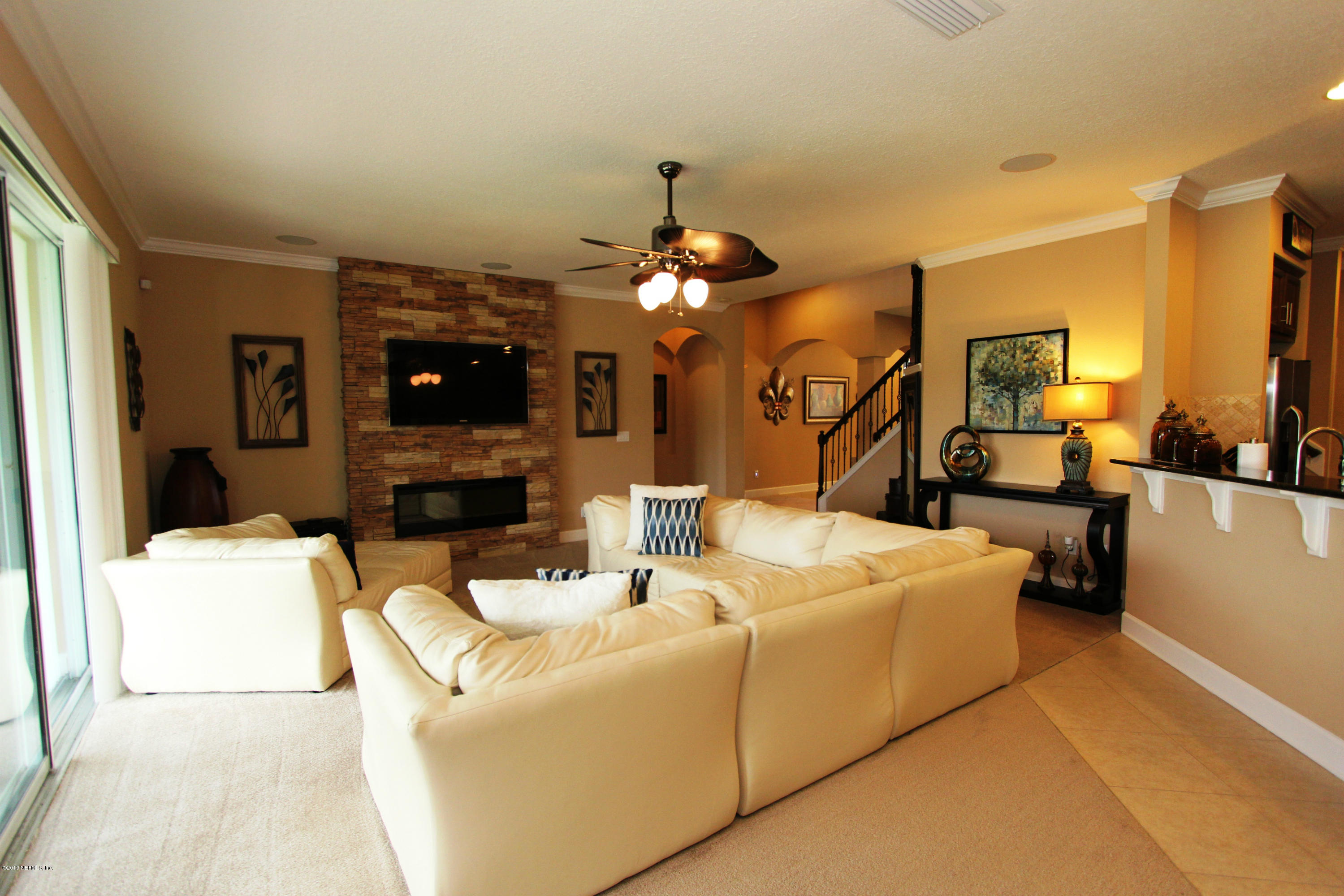 732 Castledale Court Jacksonville, FL 32259 - Photo 13 of 50 a living room with fireplace furniture and a chandelier