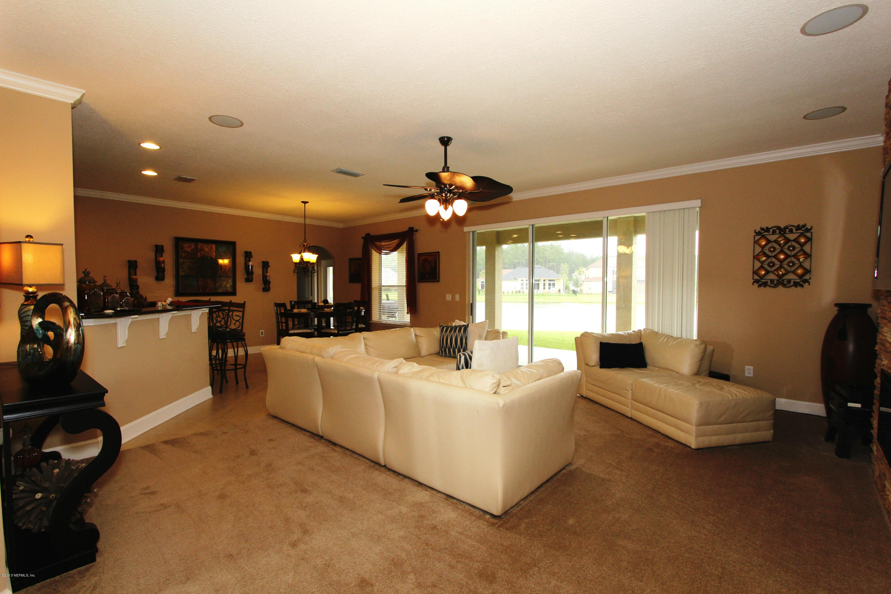 732 Castledale Court Jacksonville, FL 32259 - Photo 14 of 50 a living room with furniture and a large window