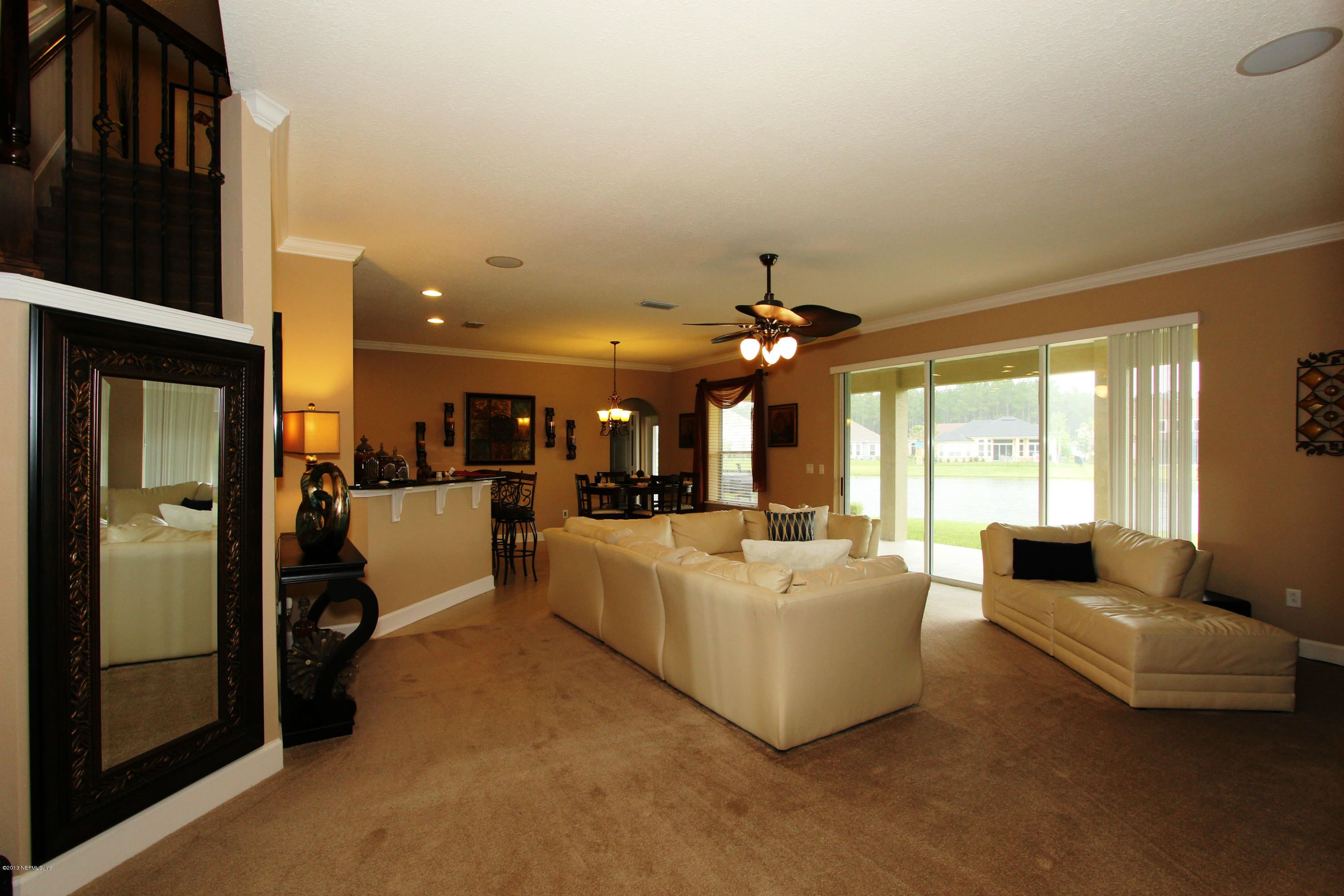 732 Castledale Court Jacksonville, FL 32259 - Photo 15 of 50 a living room with furniture and a large window