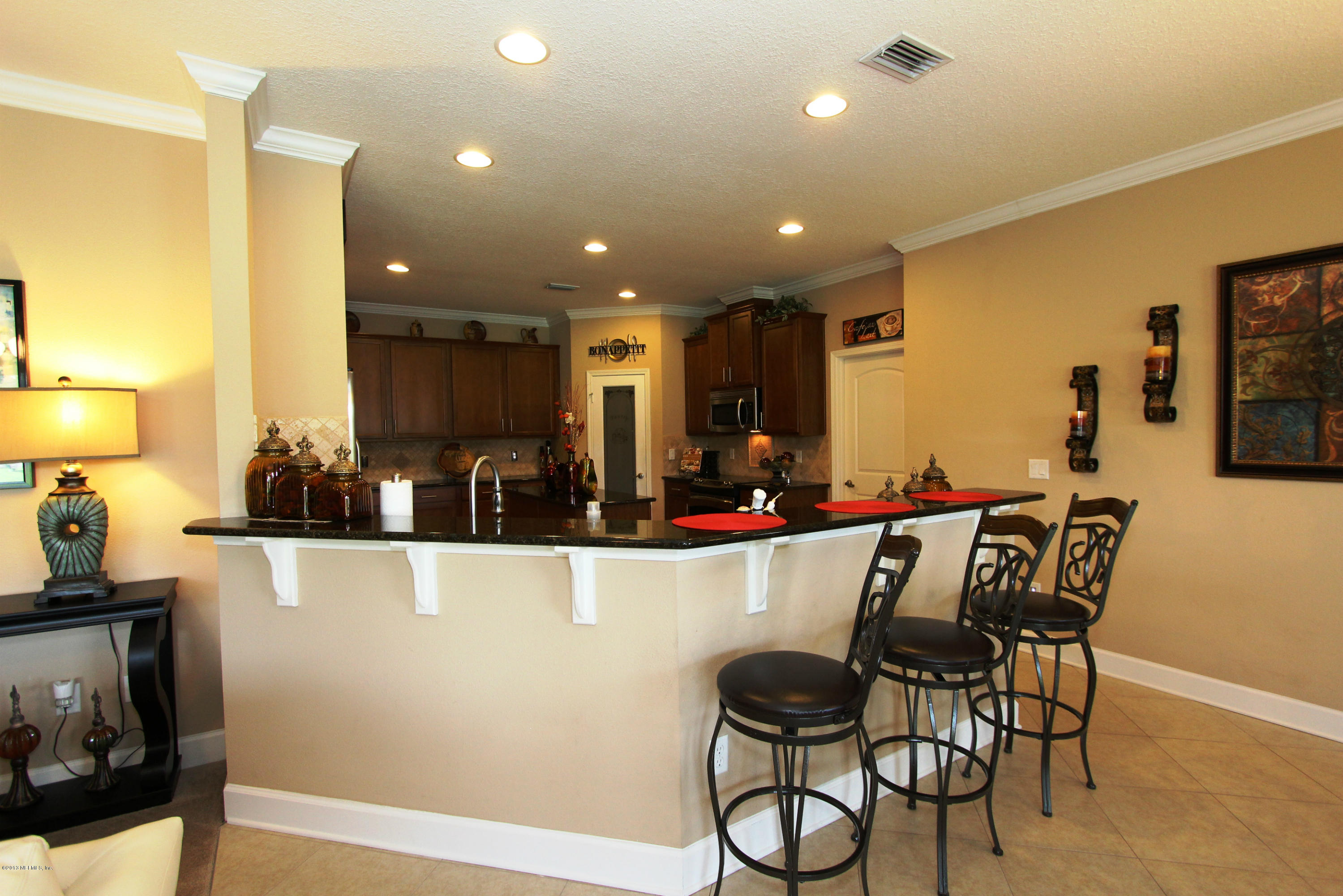 732 Castledale Court Jacksonville, FL 32259 - Photo 22 of 50 a view of a dining room with furniture and wooden floor