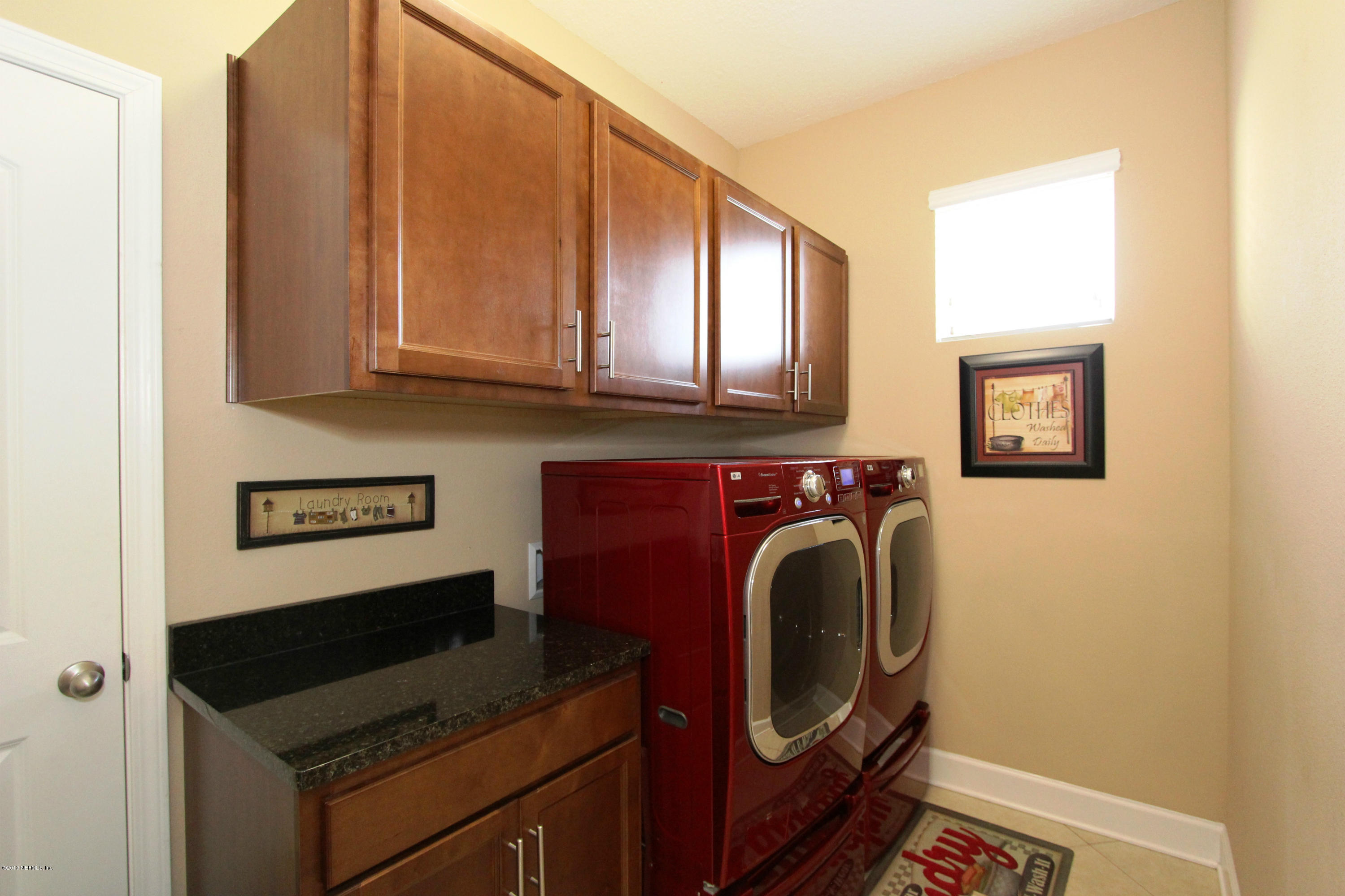 732 Castledale Court Jacksonville, FL 32259 - Photo 23 of 50 a utility room with dryer and washer