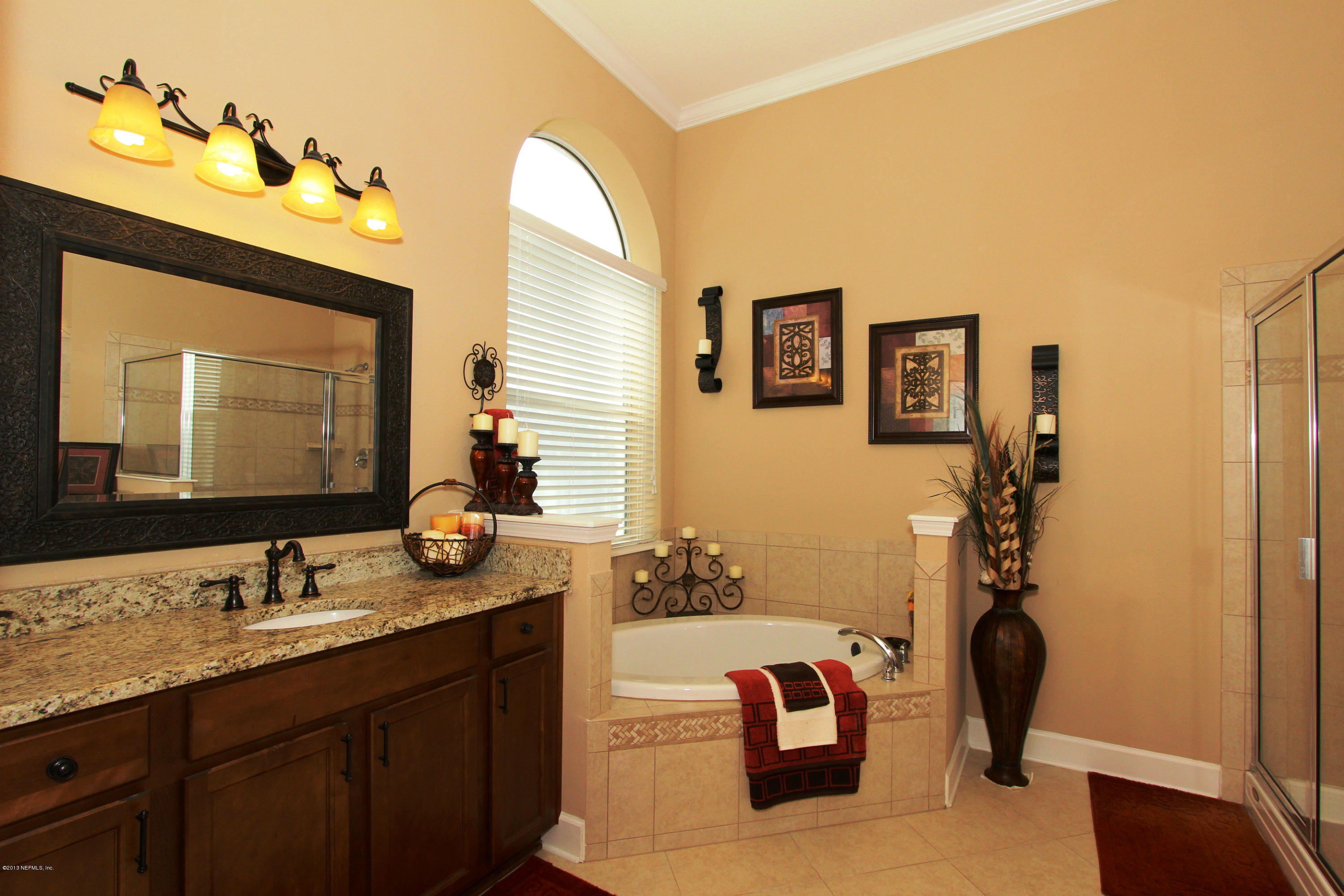 732 Castledale Court Jacksonville, FL 32259 - Photo 27 of 50 a bathroom with a sink and a mirror