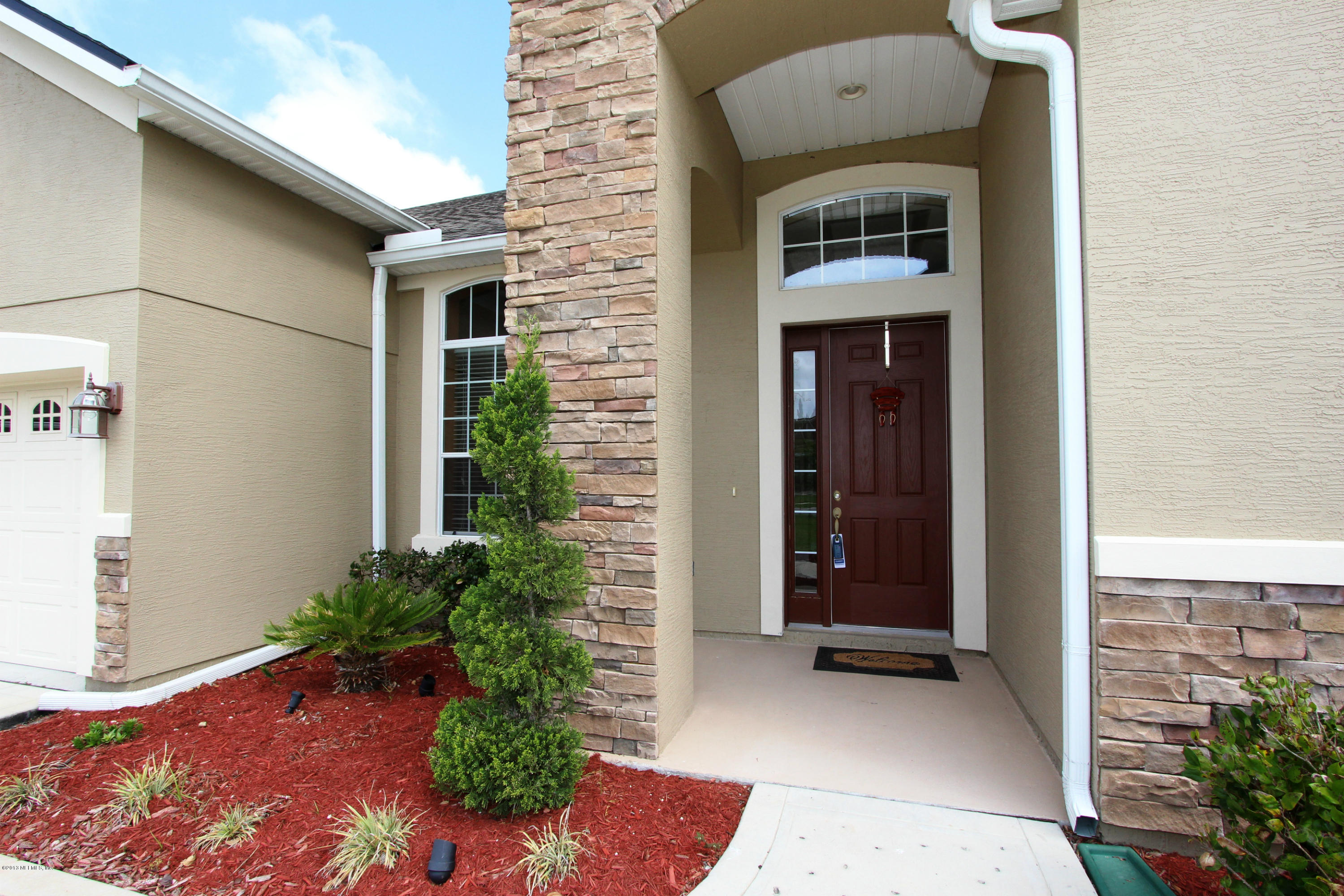 732 Castledale Court Jacksonville, FL 32259 - Photo 3 of 50 a front view of a house with a yard