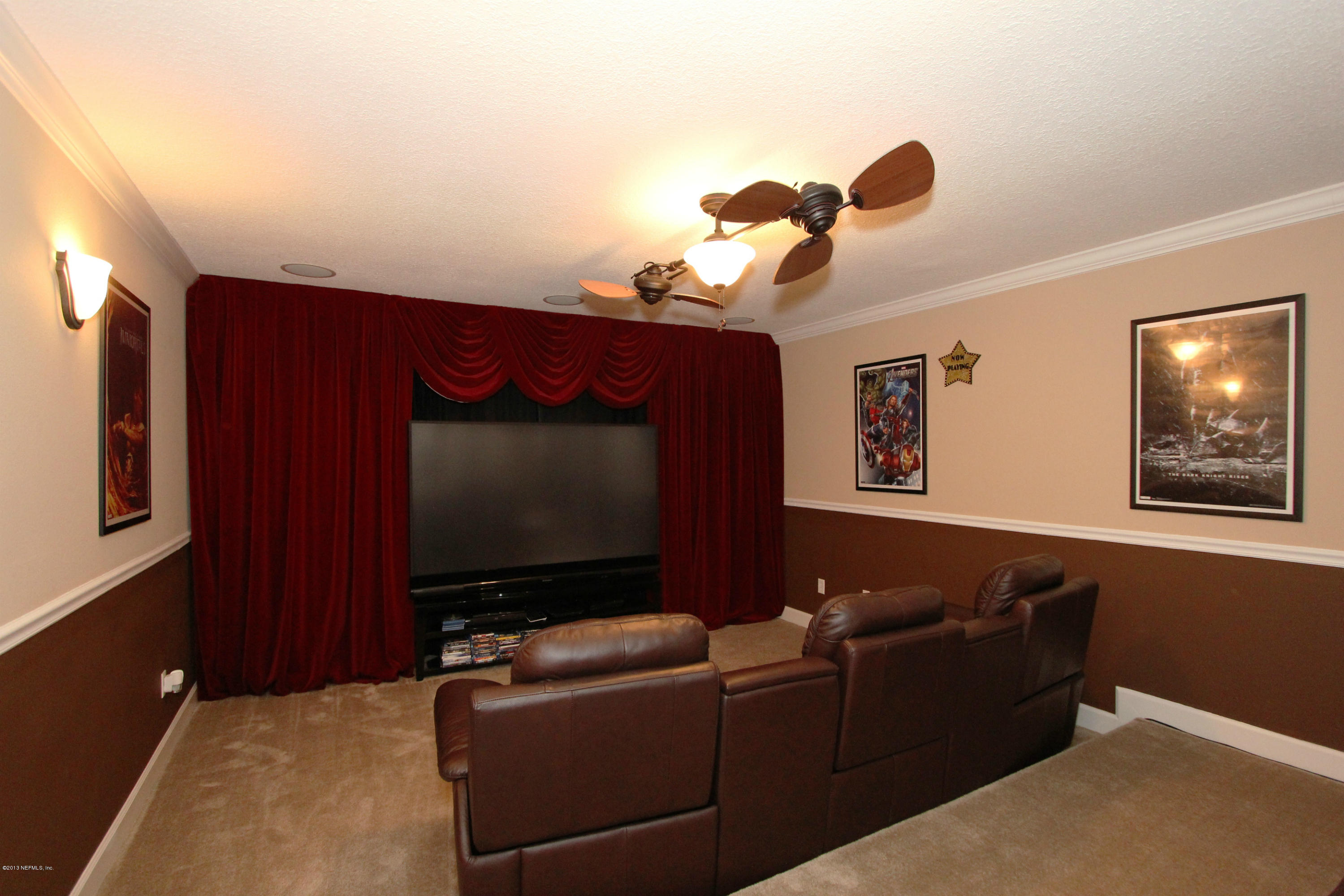732 Castledale Court Jacksonville, FL 32259 - Photo 35 of 50 a living room with furniture and a flat screen tv