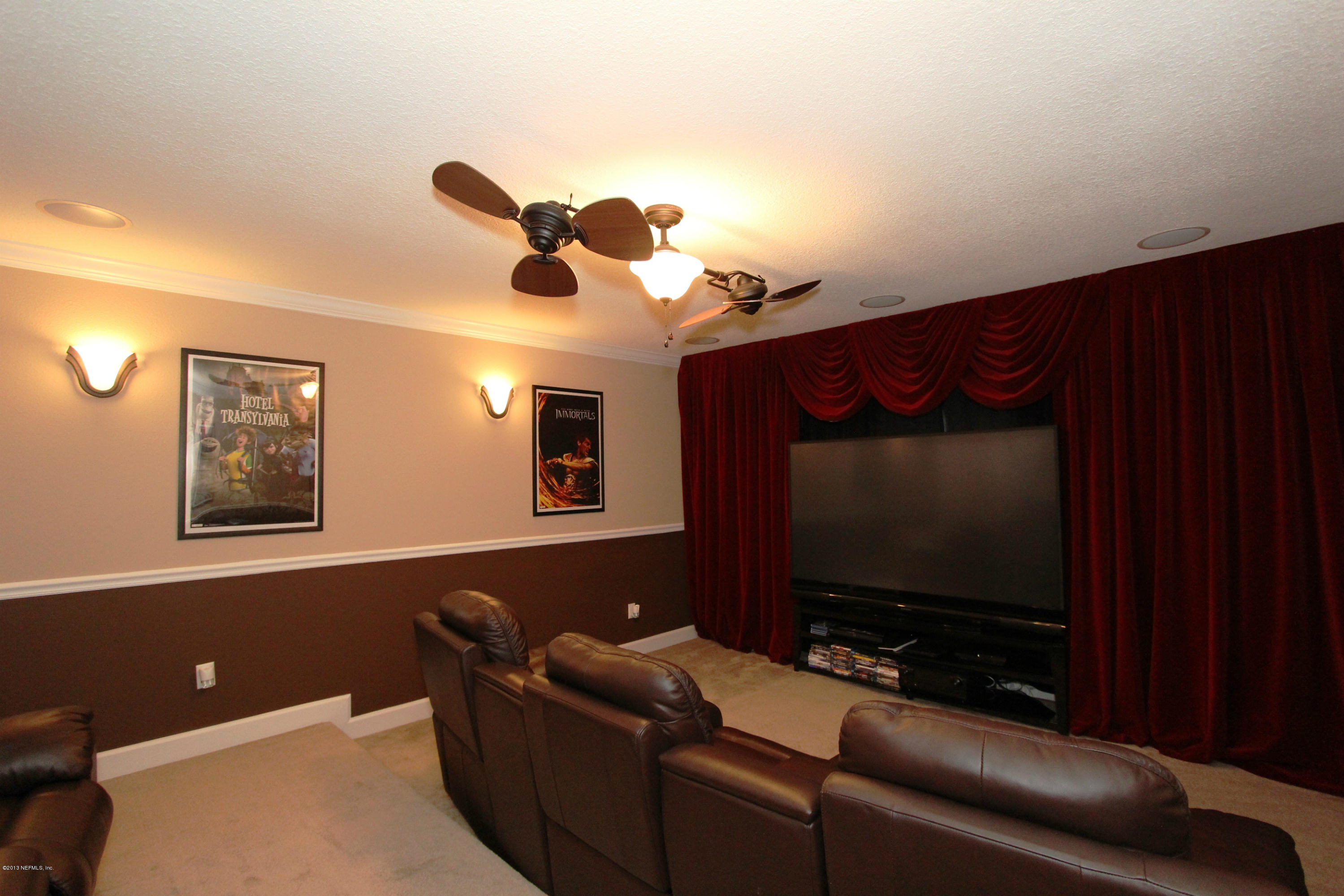 732 Castledale Court Jacksonville, FL 32259 - Photo 37 of 50 a living room with furniture and a flat screen tv