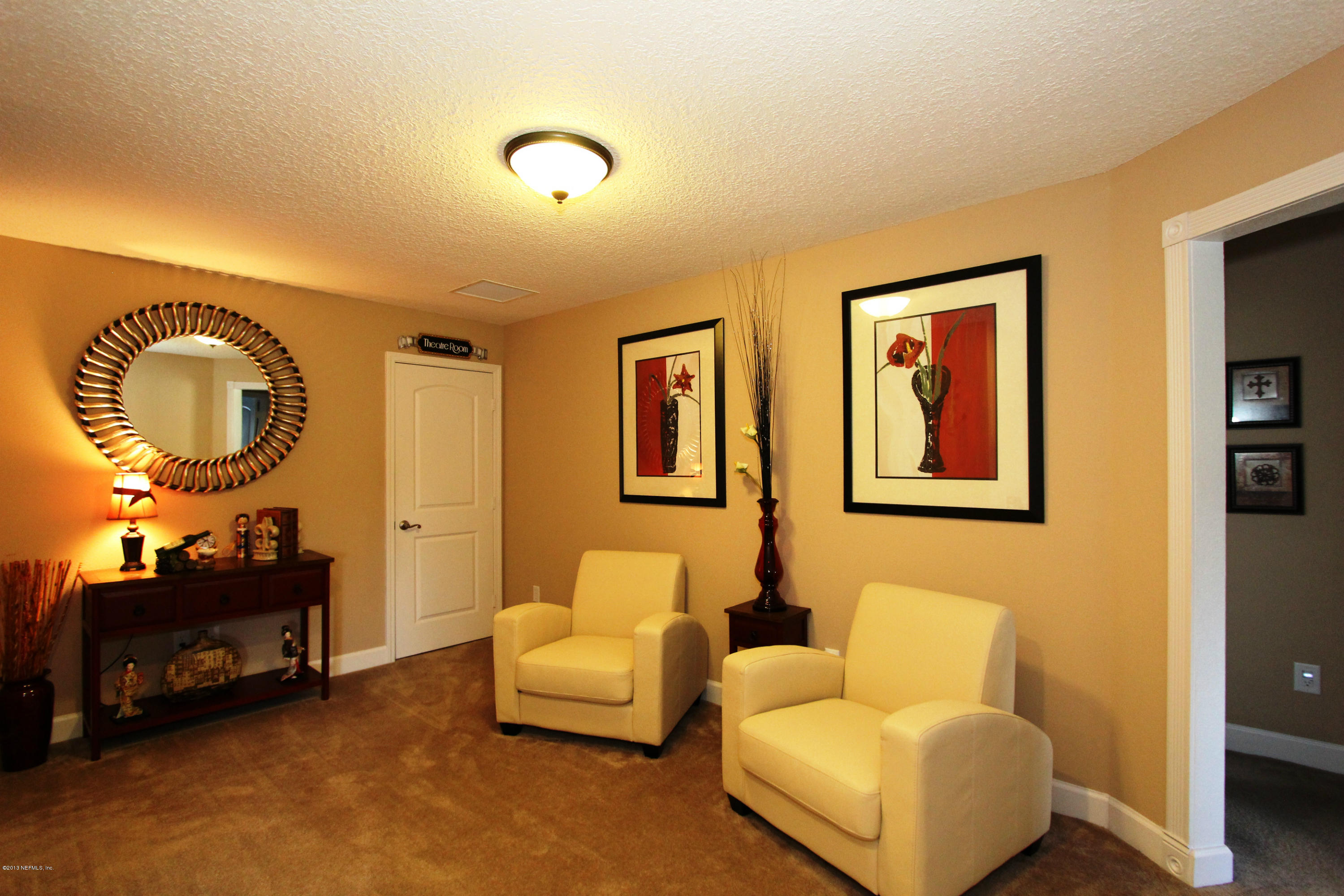 732 Castledale Court Jacksonville, FL 32259 - Photo 38 of 50 a living room with furniture and a mirror