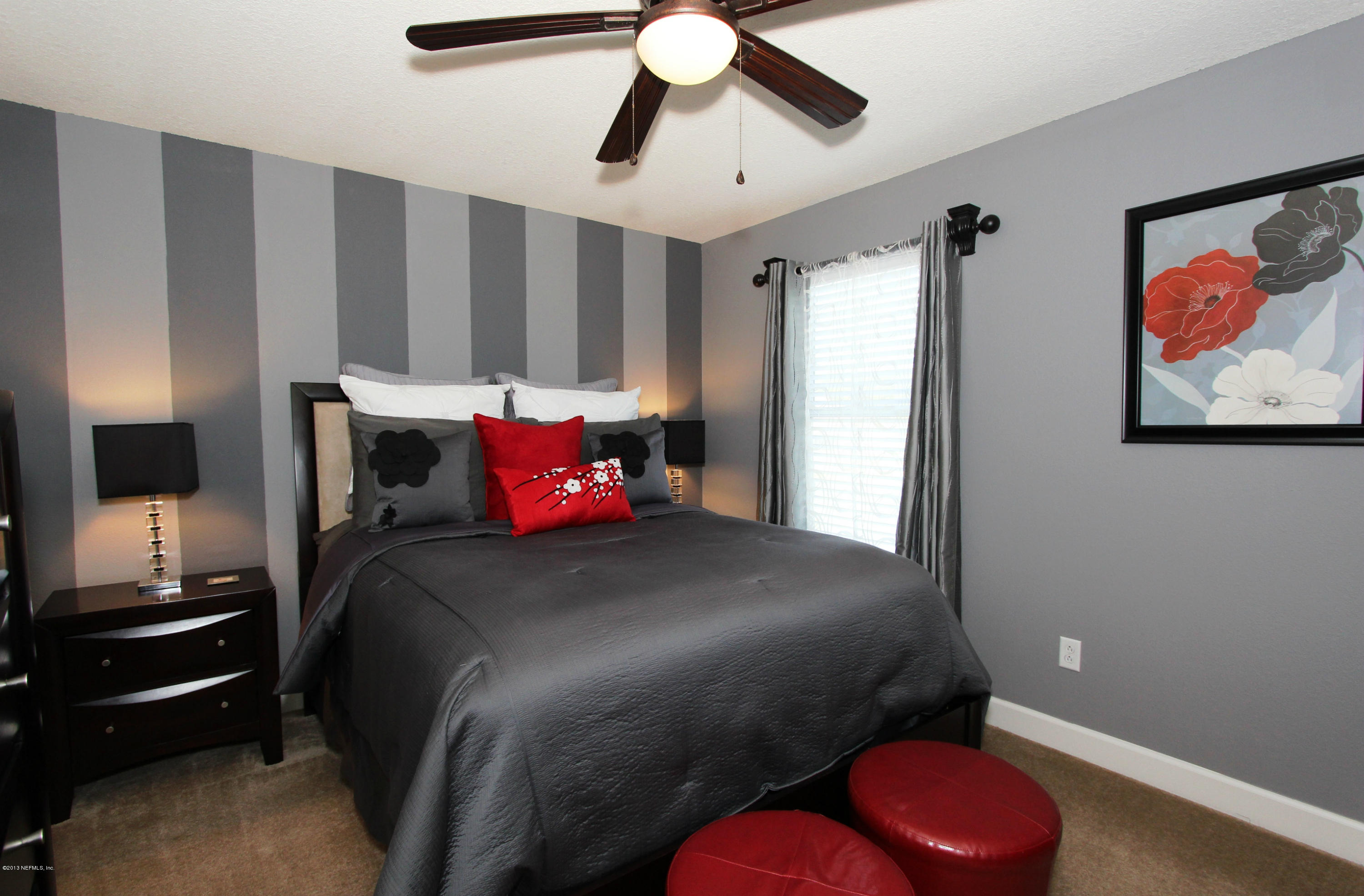 732 Castledale Court Jacksonville, FL 32259 - Photo 40 of 50 a bedroom with a bed and a chandelier